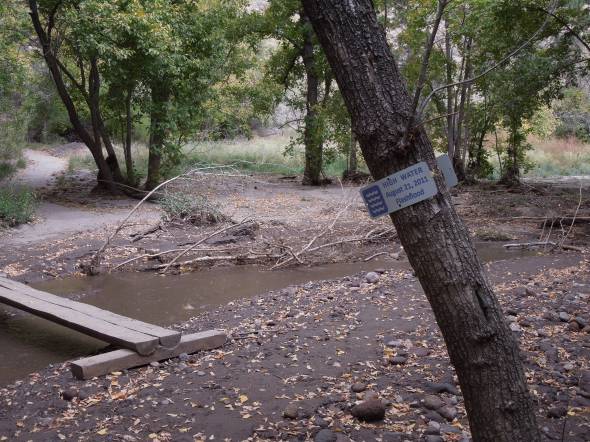 Footbridge across Frijoles Creek and high water mark.
