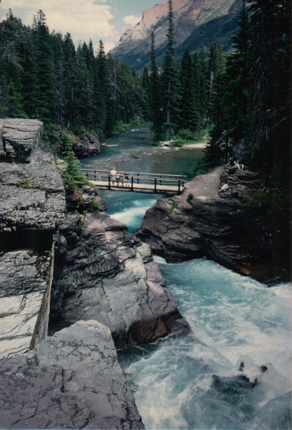 Above St. Mary Falls: footbridge, and St. Mary River continuing beyond